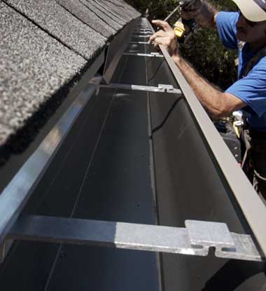 Fixing loose gutters on a home in Anne Arundel County