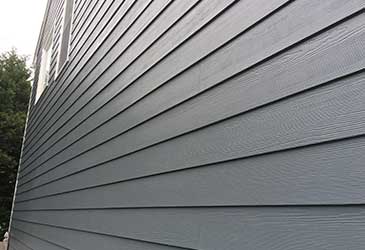 Close up of new siding panels on a house in Anne Arundel County