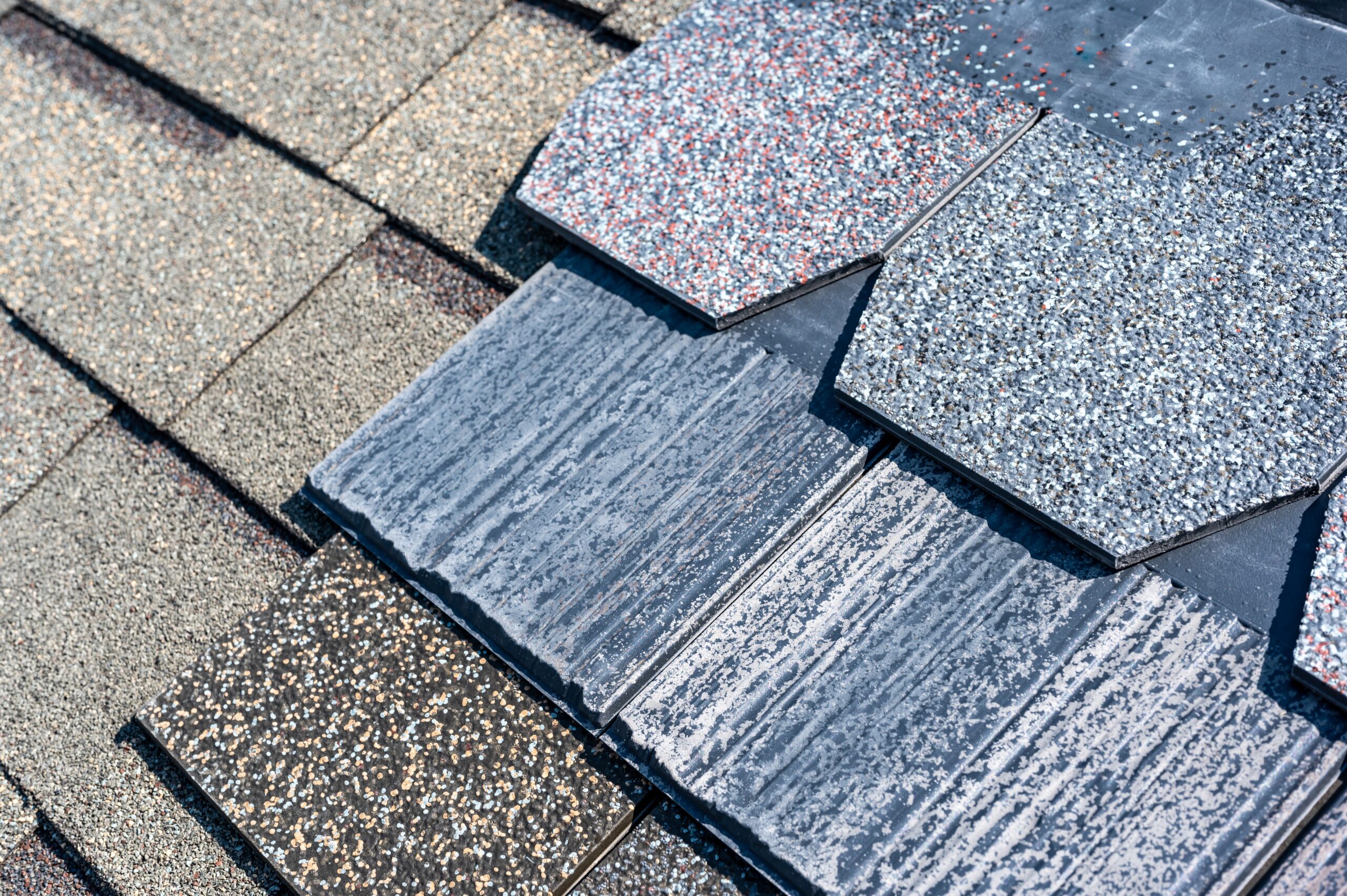 Close-up of various roofing shingle styles offered by Roofing Pups in Maryland, showcasing color and material options for residential roof installation.